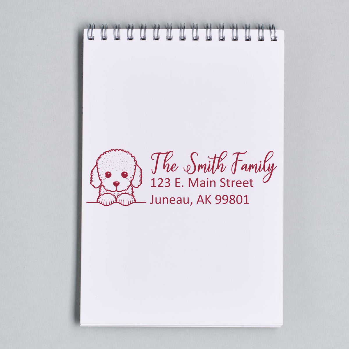 Custom rubber address stamp with dog illustration for The Smith Family, featuring name and Juneau, AK mailing address.