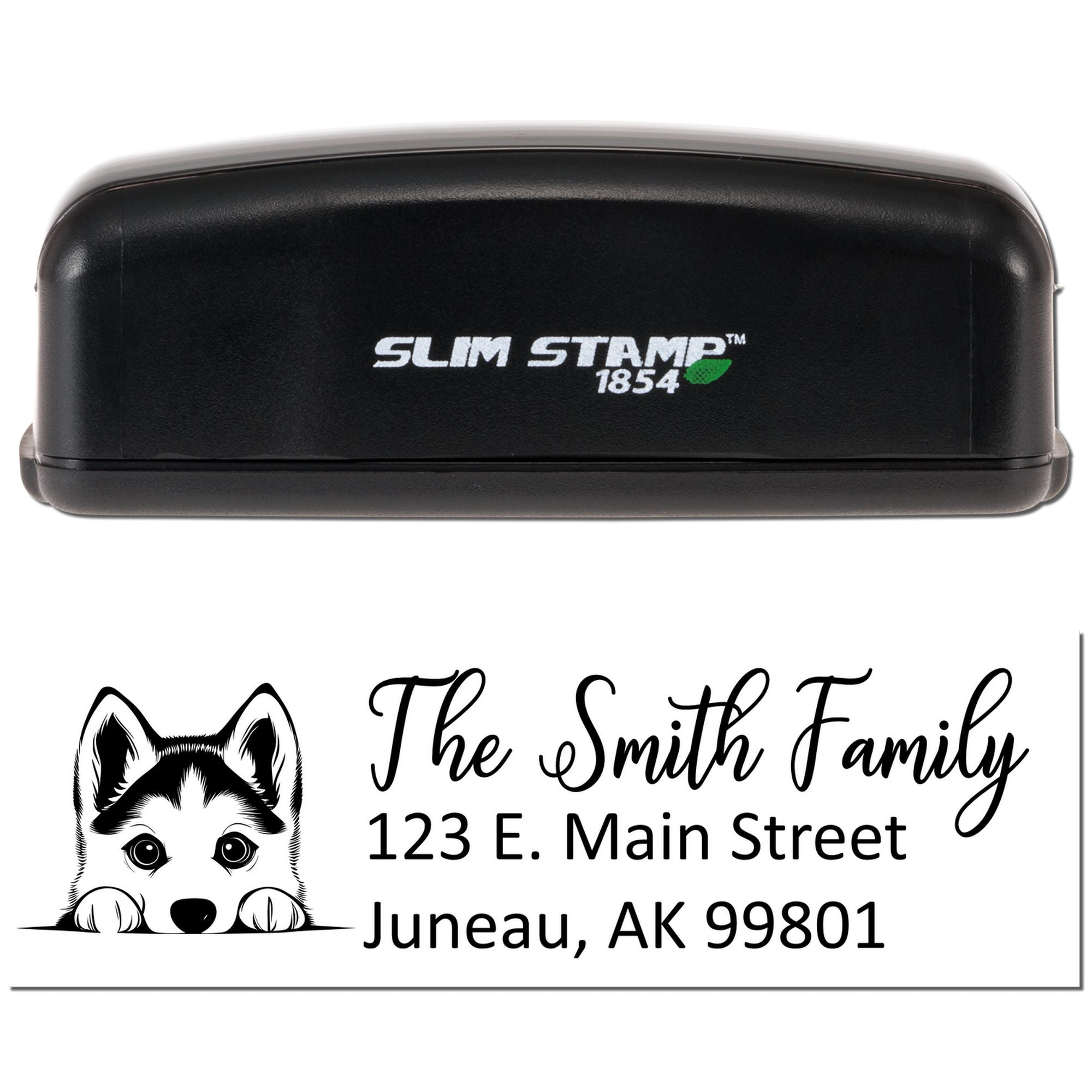 Custom self-inking rubber stamp with husky design and return address for The Smith Family, Juneau, AK 99801.