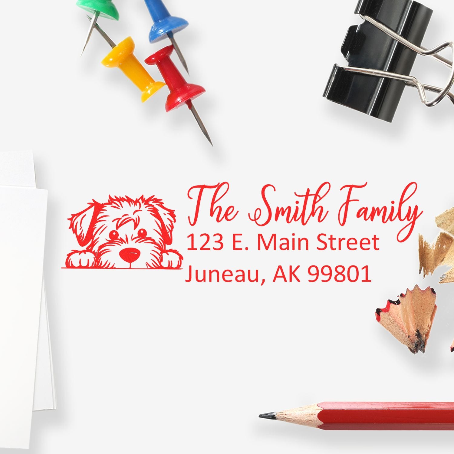 Personalized rubber return address stamp with dog graphic for The Smith Family, Juneau, AK 99801.