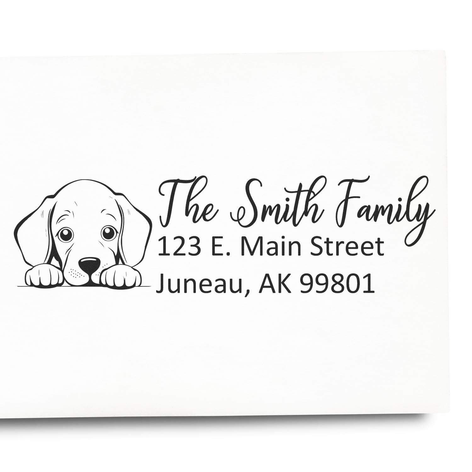 Personalized return address rubber stamp with puppy illustration for The Smith Family, Juneau, AK 99801.