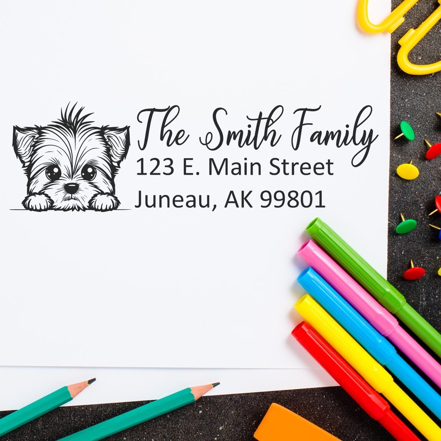 Personalized address rubber stamp with dog illustration, custom family name and return address for envelopes.