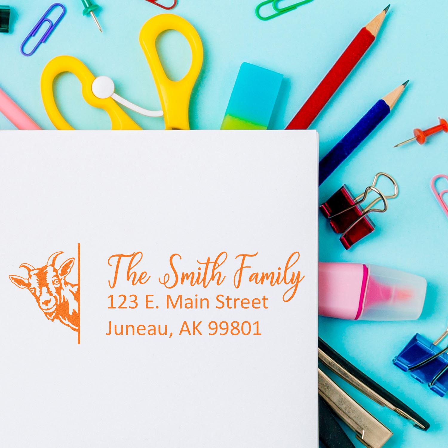 Custom return address rubber stamp with goat logo for The Smith Family, featuring name and Alaska address.