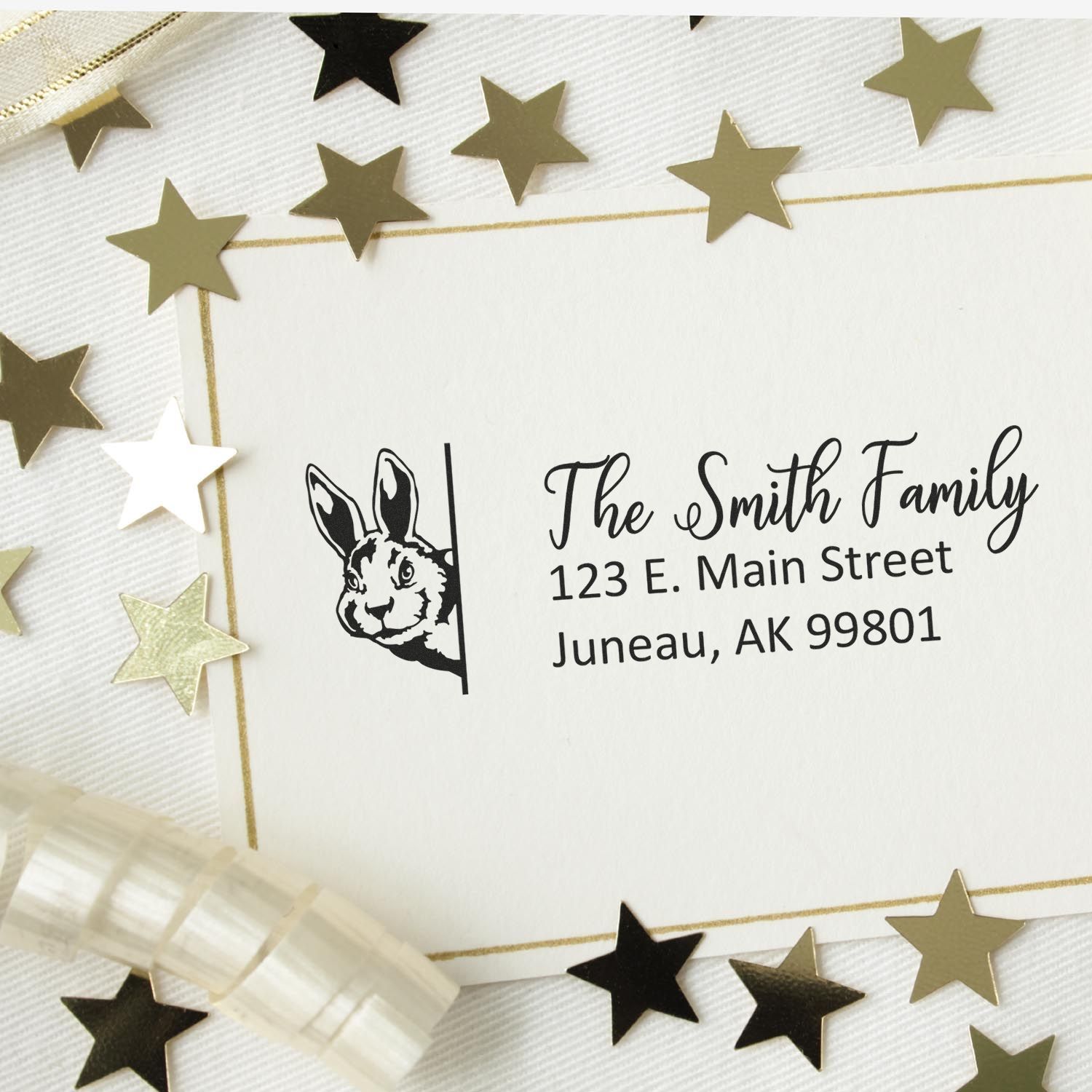 Custom rabbit rubber stamp return address design for personalized envelopes, featuring The Smith Family in Juneau, AK.