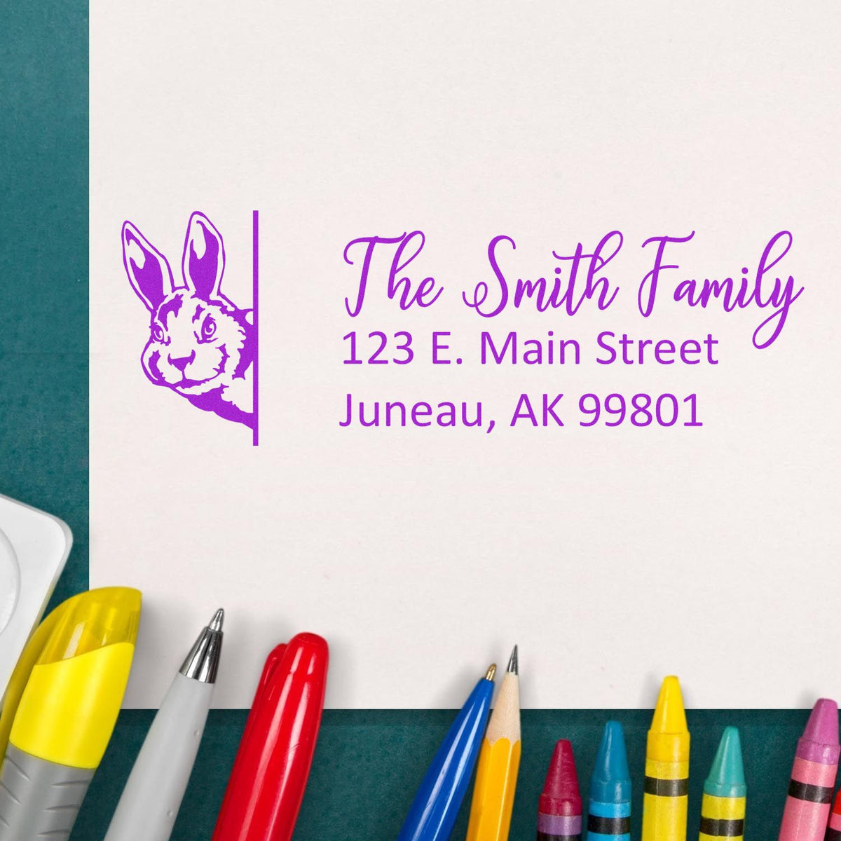 Custom family address rubber stamp with bunny design for The Smith Family, 123 E. Main Street, Juneau, AK 99801.