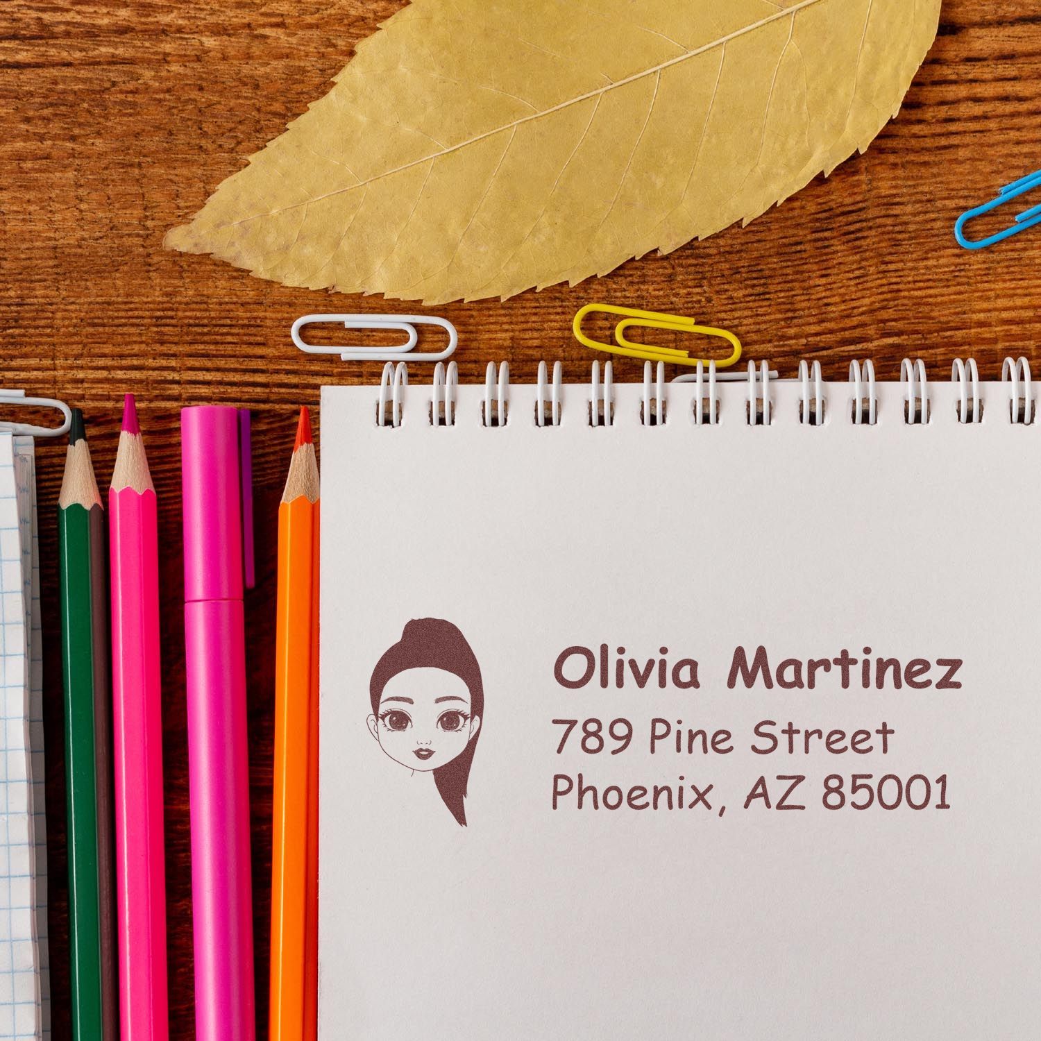 Personalized return address rubber stamp with girl icon, featuring Olivia Martinez name and Phoenix, AZ address for stationery.