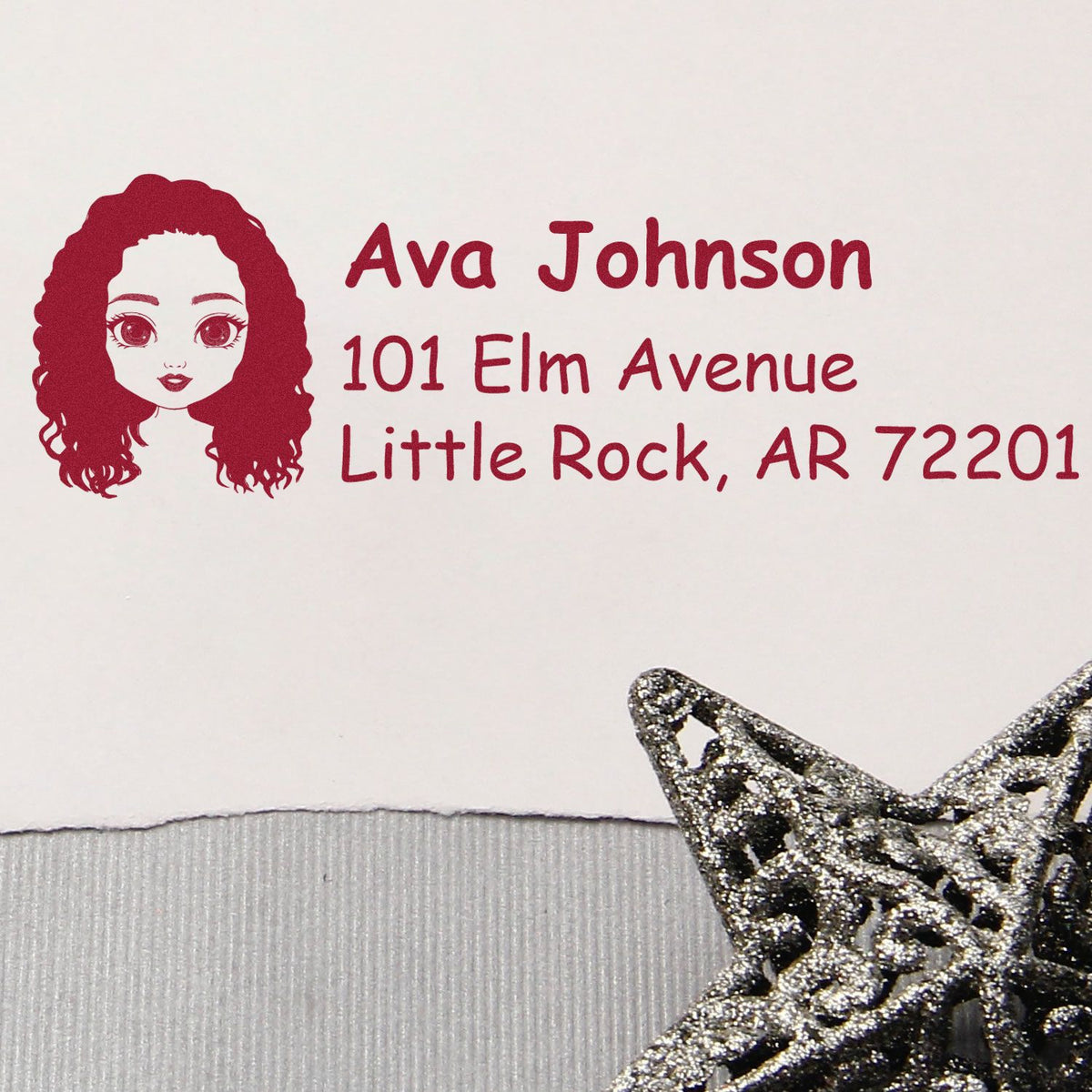 Custom rubber address stamp with girl portrait for Ava Johnson, 101 Elm Avenue, Little Rock, AR 72201.