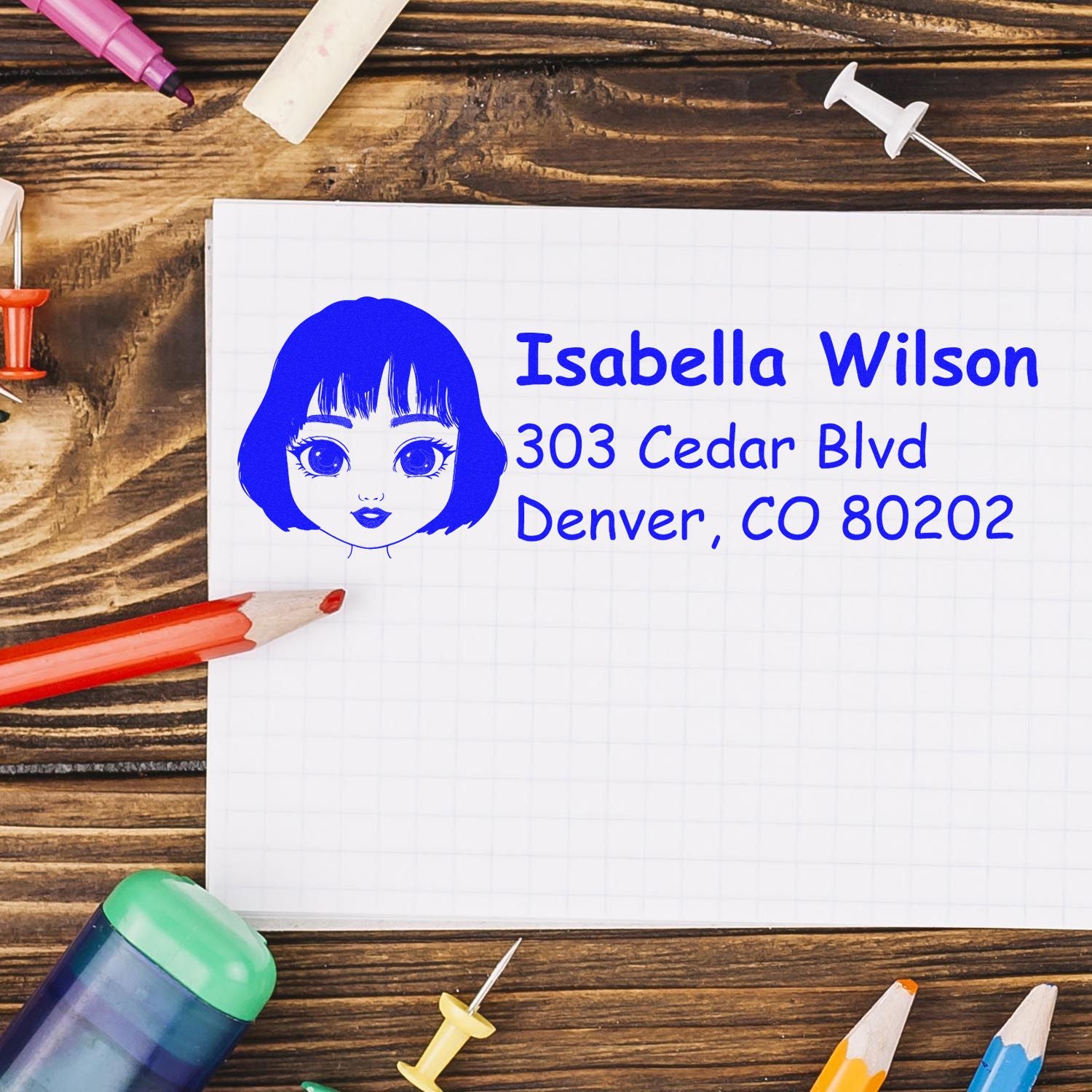 Personalized rubber address stamp featuring name, avatar, and mailing address for custom stationery and envelopes.
