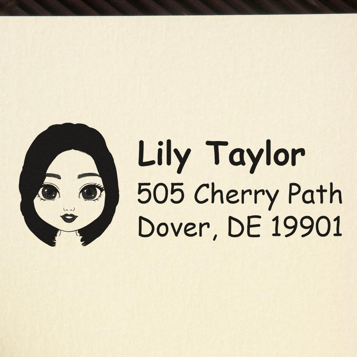Custom return address rubber stamp with illustrated portrait, Lily Taylor, 505 Cherry Path, Dover, DE 19901.