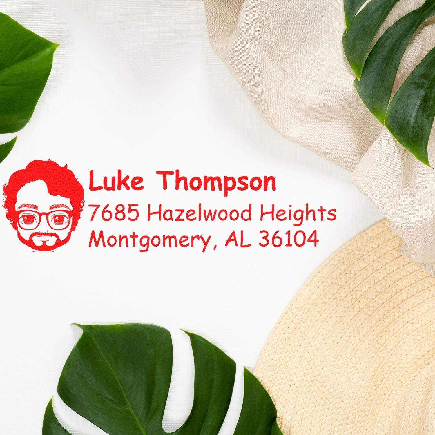 Custom address rubber stamp with Luke Thompson, Montgomery, AL 36104 and portrait icon for envelopes and mail.