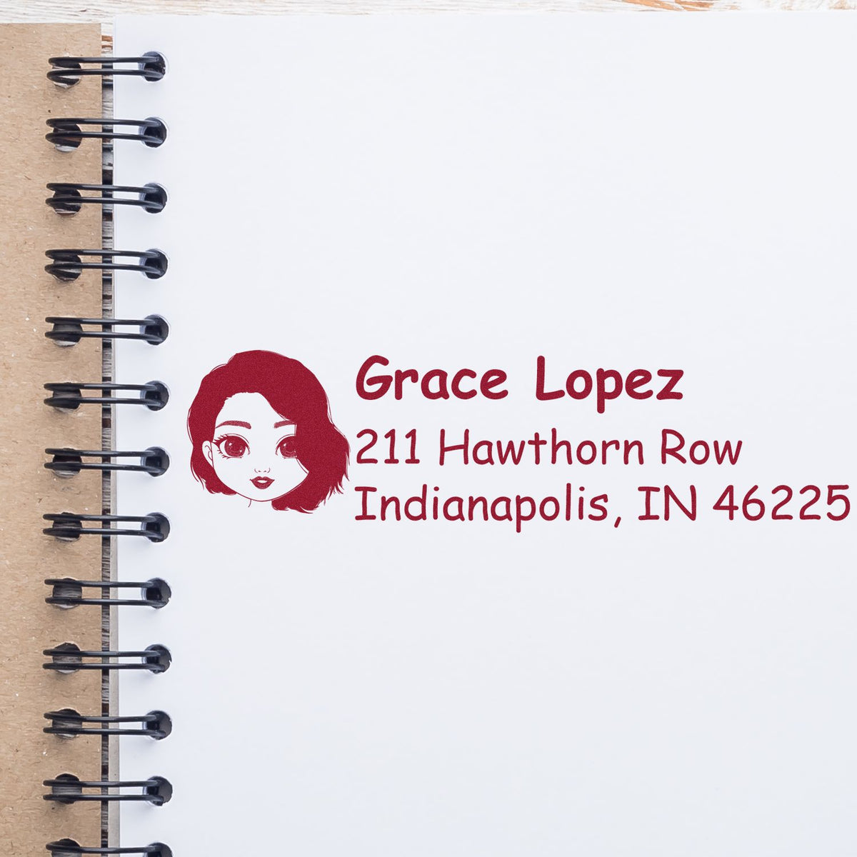 Custom return address rubber stamp with name, address and portrait logo for personalized mailing and stationery.