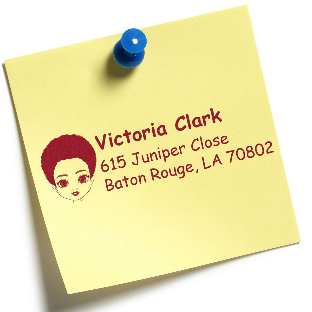 Custom address rubber stamp on yellow sticky note with blue pushpin, featuring Victoria Clark and Baton Rouge, LA mailing details.