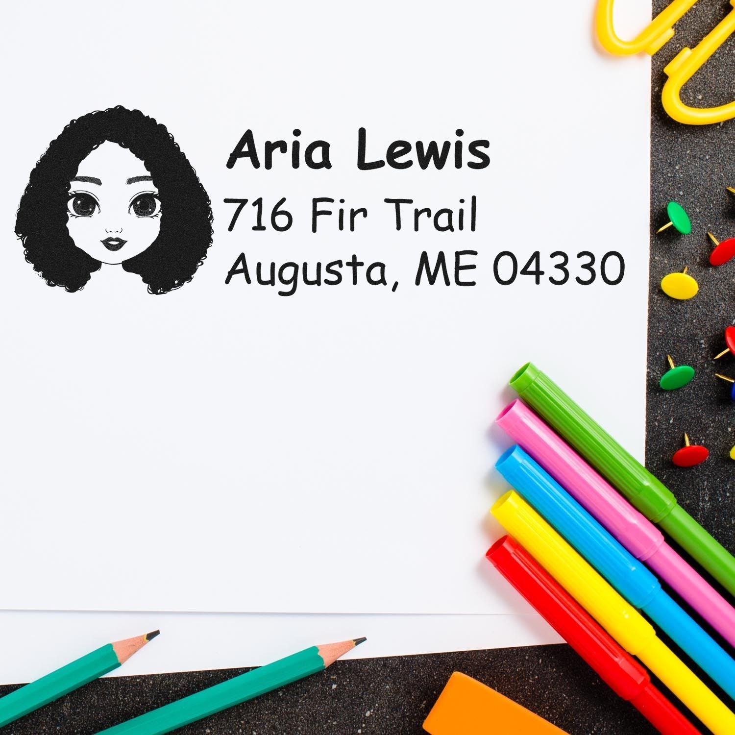 Personalized rubber address stamp with girl avatar, name, and Augusta, ME mailing address for envelopes.