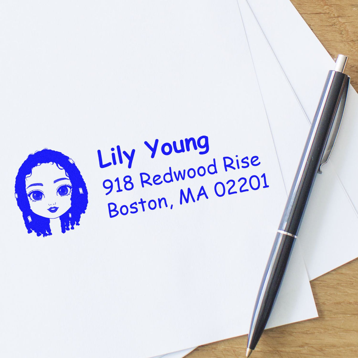 Personalized address rubber stamp with name and Boston, MA return address in blue ink on white paper.