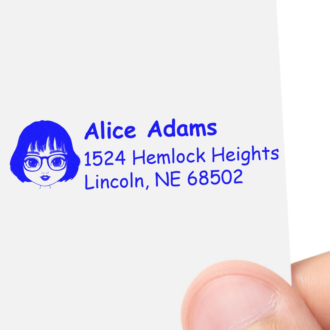 Custom rubber address stamp with name Alice Adams, Lincoln, NE 68502, and blue illustrated face logo.
