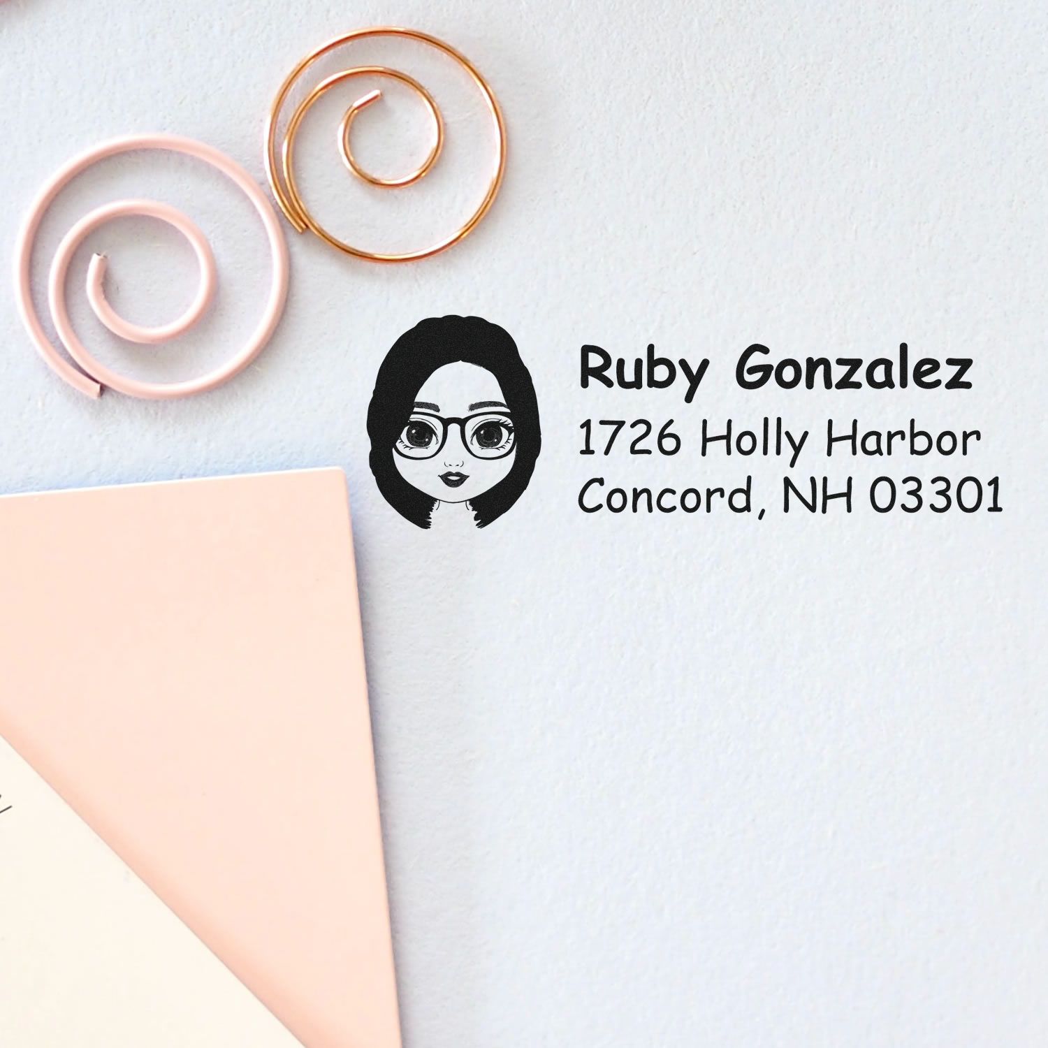 Custom return address rubber stamp with female avatar, Ruby Gonzalez name, and Concord, NH mailing address for envelopes.