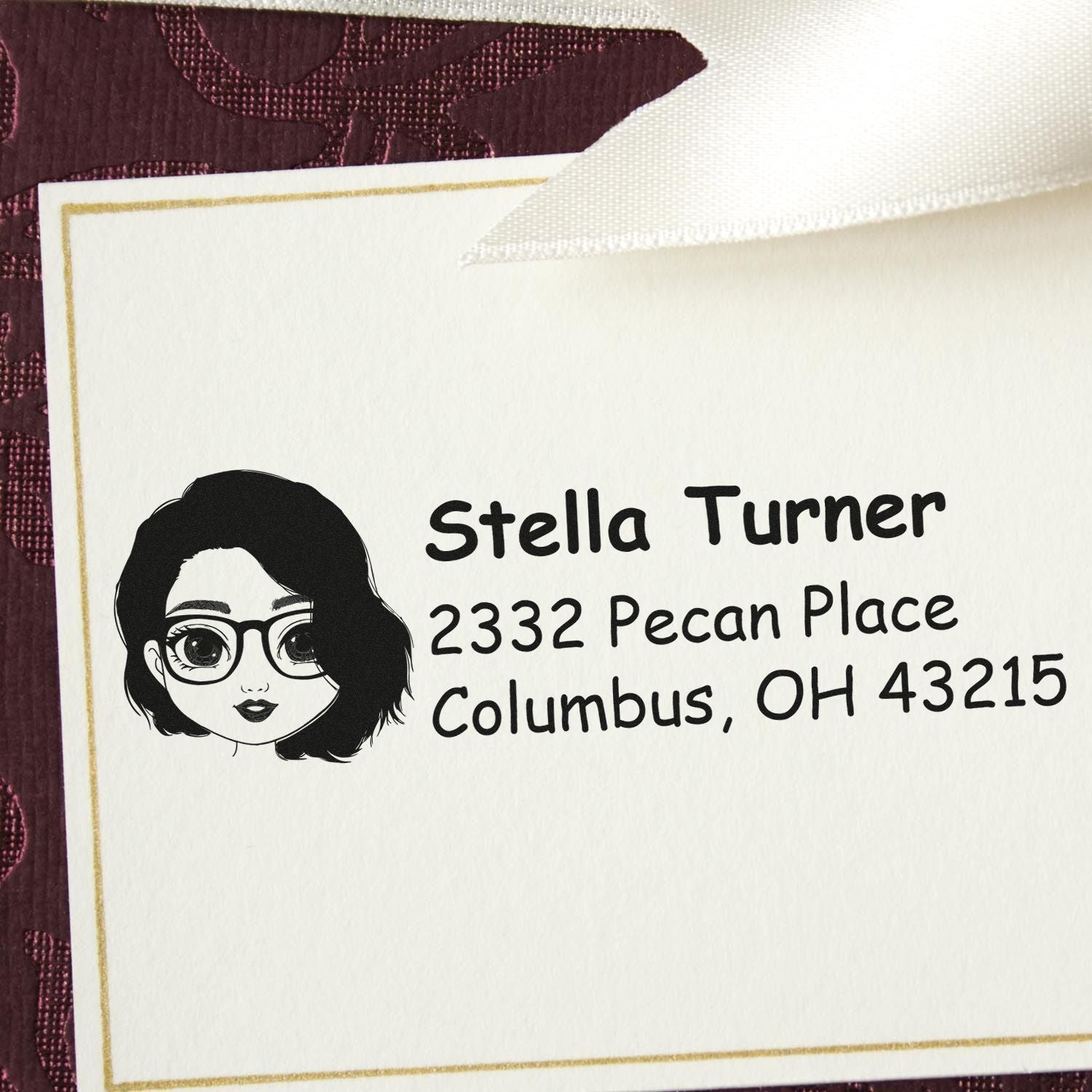 Custom address rubber stamp with illustrated avatar, name, and Columbus, OH return address.