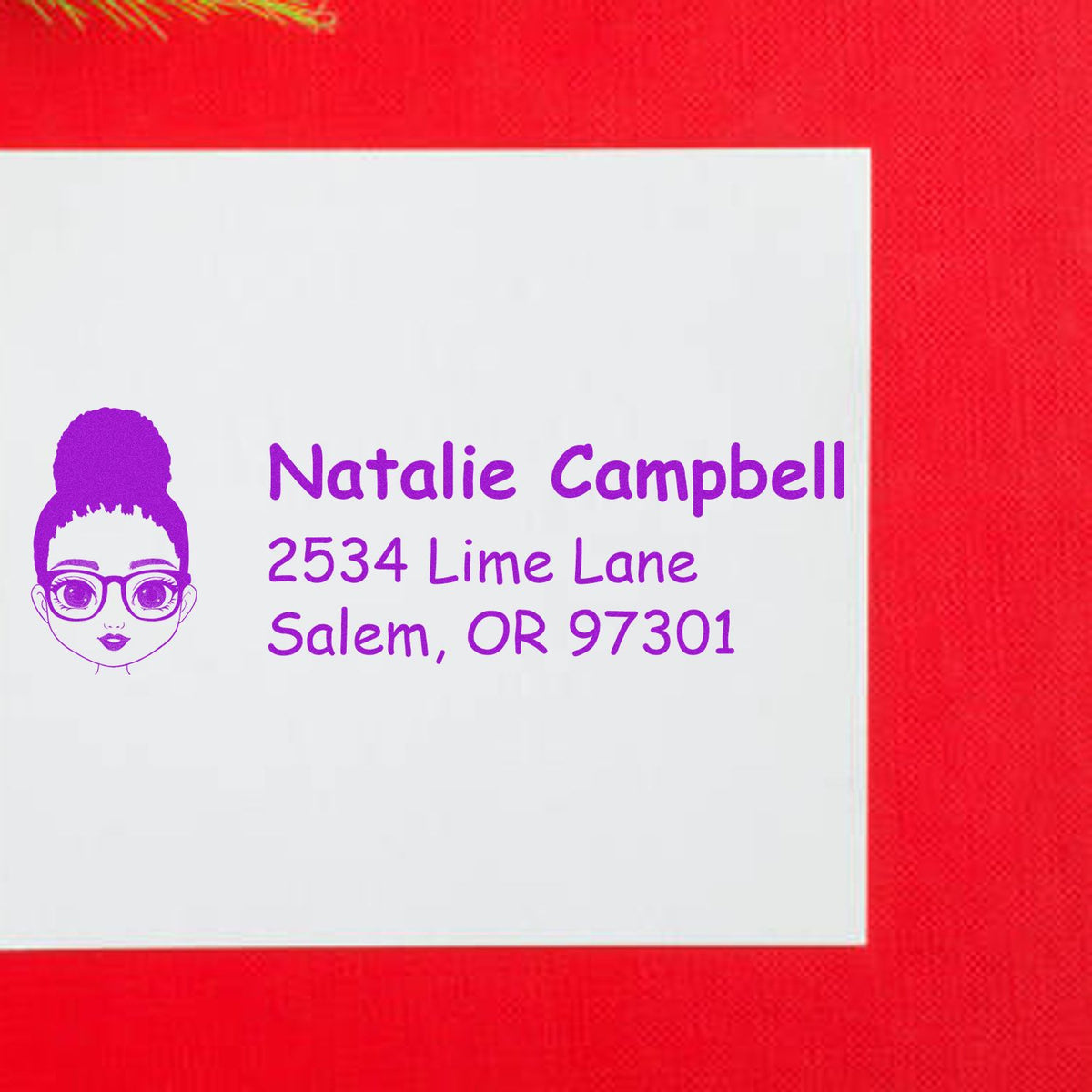 Personalized address rubber stamp with cartoon girl logo and purple text for Natalie Campbell, Salem, OR 97301