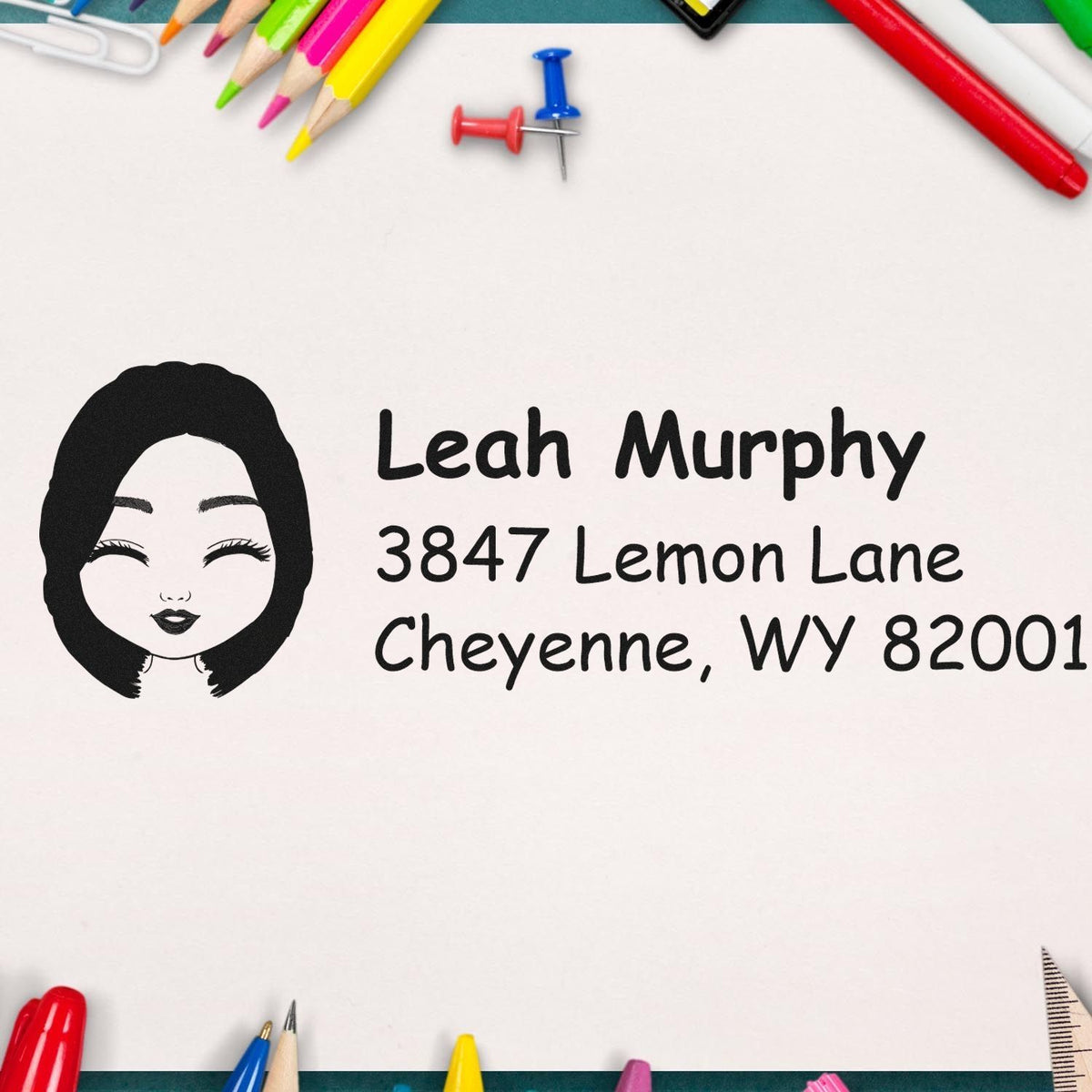 Custom return address rubber stamp with portrait icon, name, and address for mailing labels and envelopes.