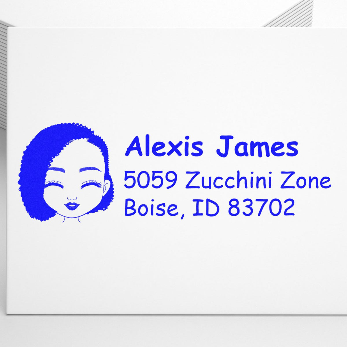 Custom rubber address stamp for Alexis James, Boise, ID 83702, featuring a blue avatar design.