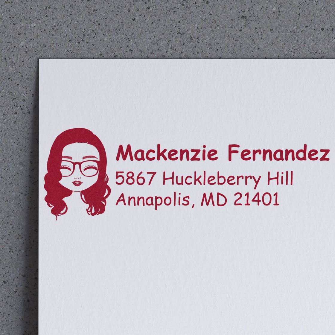 Custom rubber address stamp with female avatar, Mackenzie Fernandez, and Annapolis, MD return address.