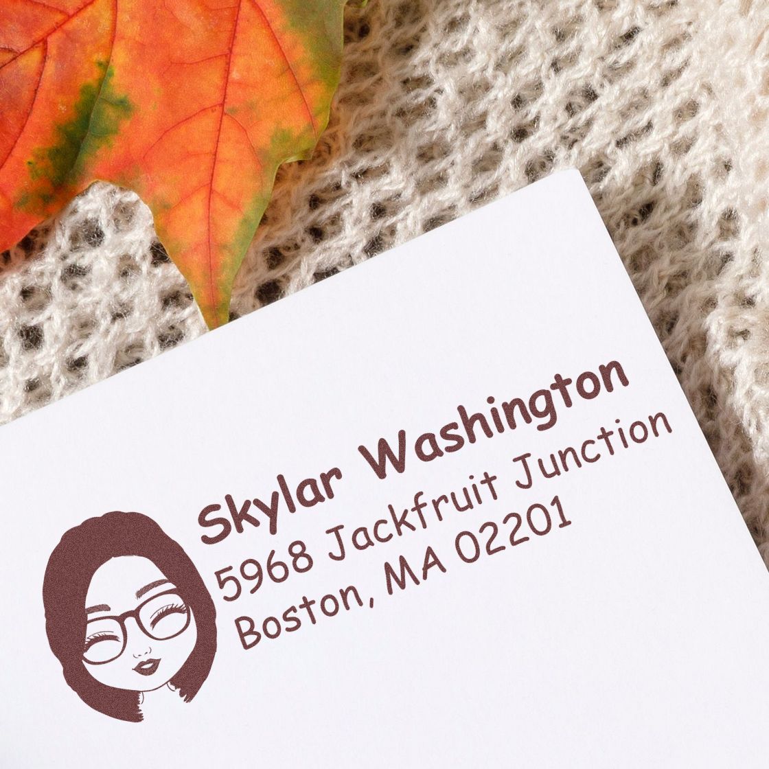 Custom rubber stamp return address with woman logo, showing Skylar Washington, 5968 Jackfruit Junction, Boston, MA 02201.