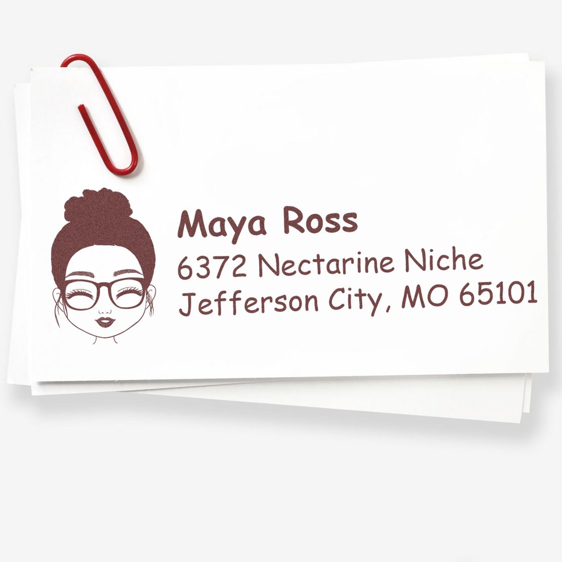 Custom rubber return address stamp with female portrait icon, Maya Ross name, and Jefferson City, MO mailing address.