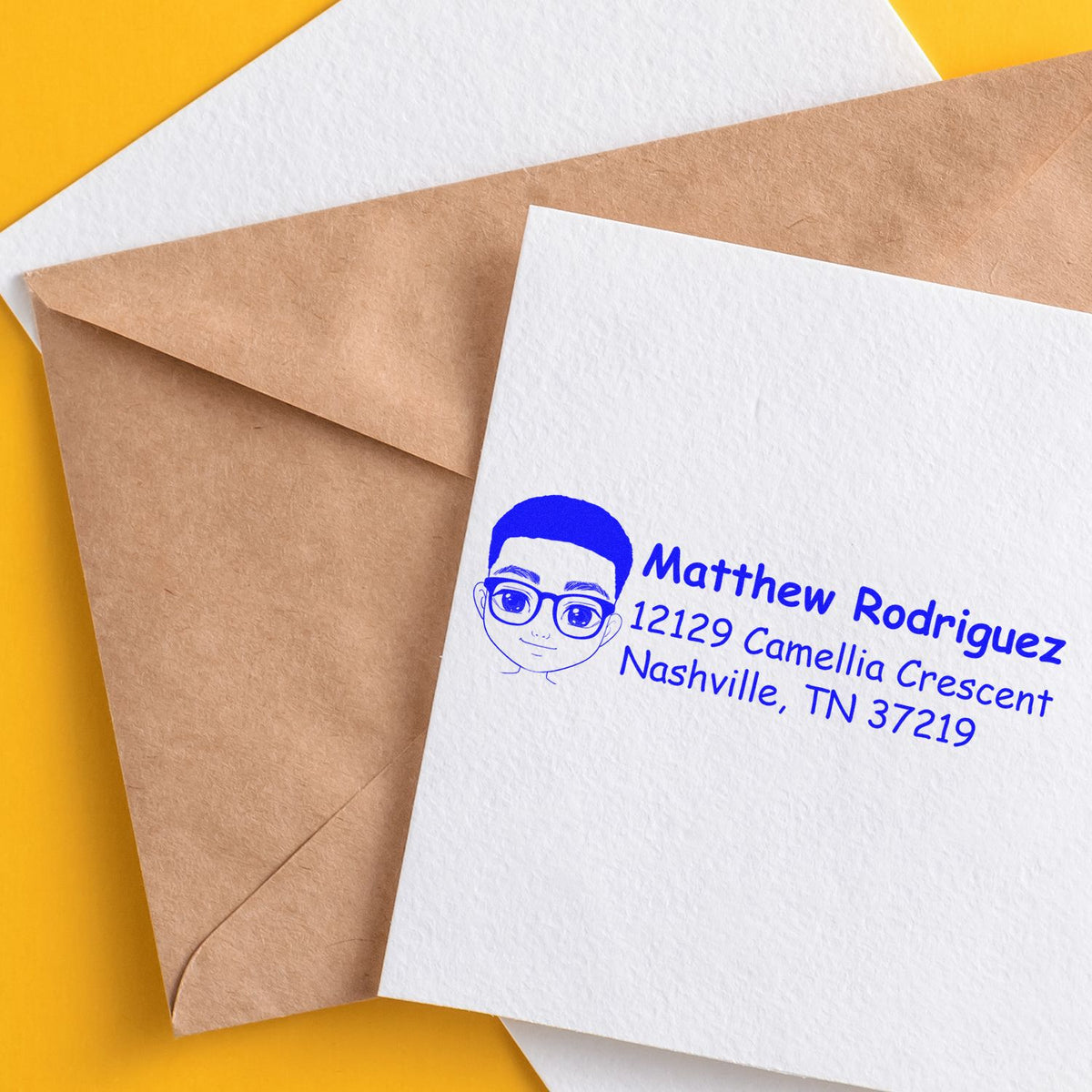 Custom rubber address stamp on envelope, showing personalized return address and illustration for mailing and stationery.