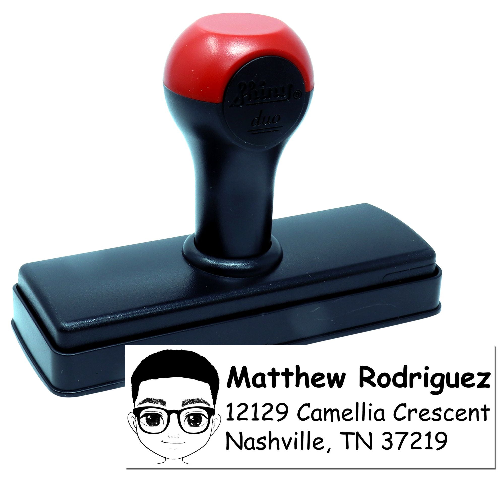 Custom self-inking rubber return address stamp with cartoon portrait for personalized envelopes and mailings.