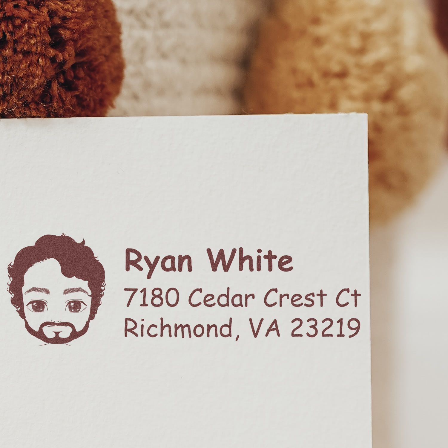Custom rubber return address stamp with illustrated face icon, name, and Richmond, VA mailing address.