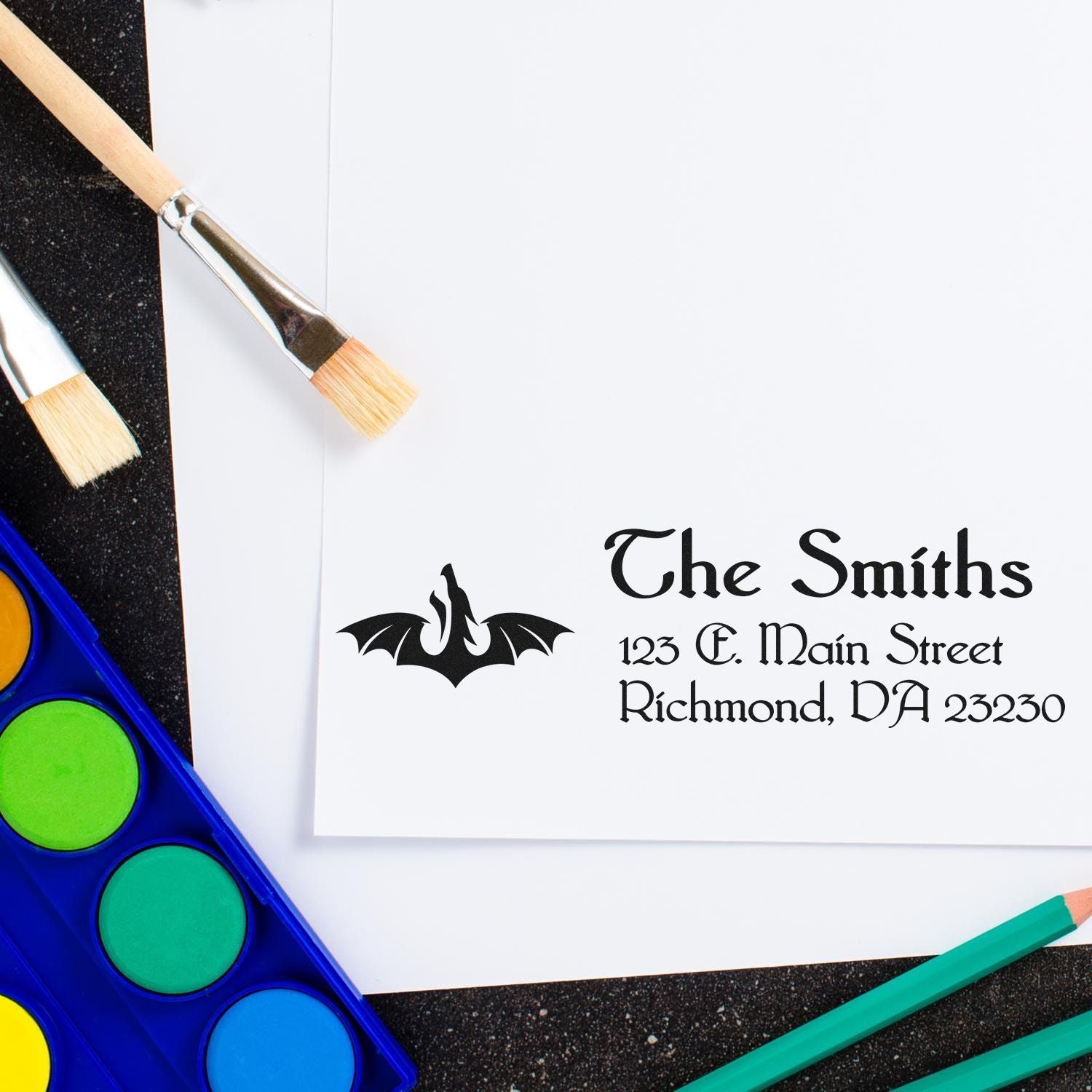 Custom rubber address stamp with bat logo and The Smiths return address for Halloween stationery.