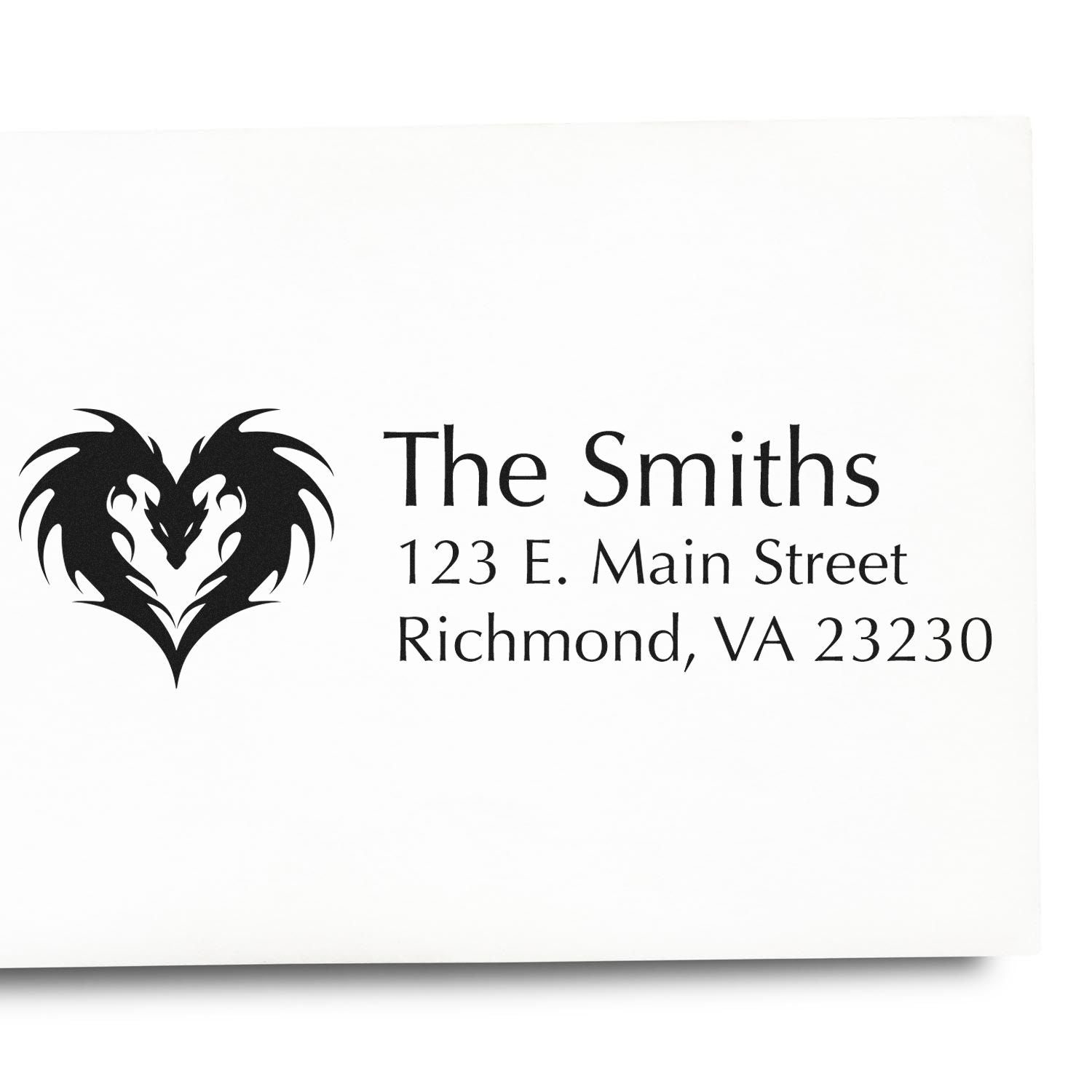 Custom self-inking rubber address stamp for The Smiths with dragon heart logo, 123 E. Main Street, Richmond, VA 23230.