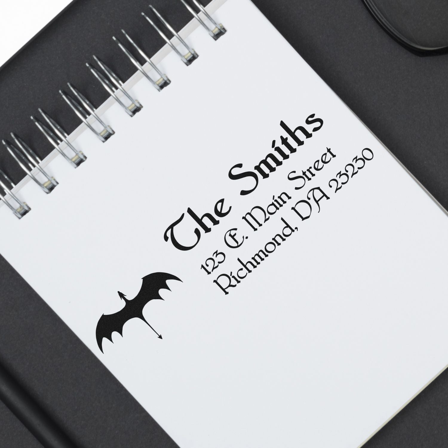 Personalized rubber address stamp with bat icon for The Smiths, 123 E. Main Street, Richmond, VA 23230