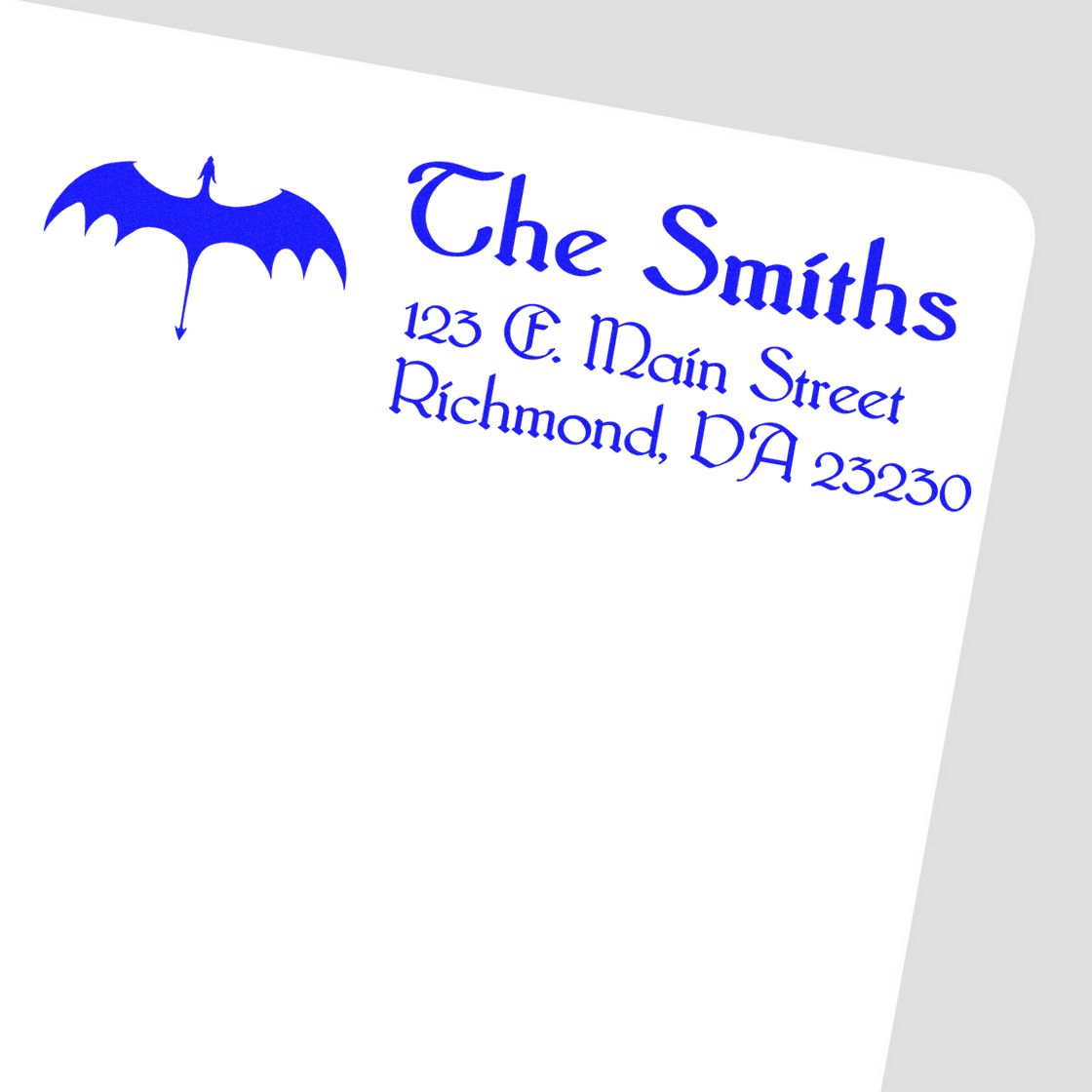 Custom return address rubber stamp with bat logo, The Smiths, 123 E. Main Street, Richmond, DA 23230 in blue.