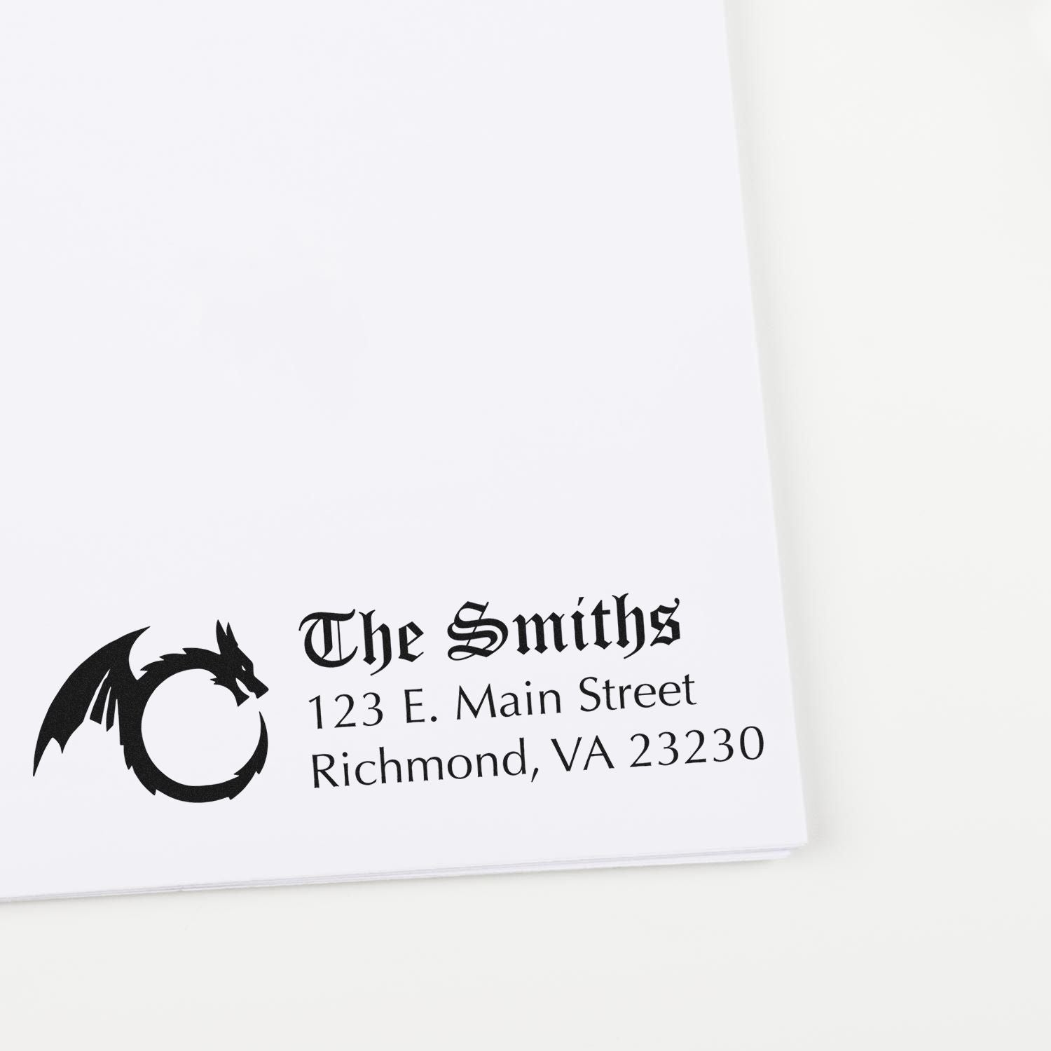 Custom address rubber stamp with dragon logo for The Smiths, 123 E. Main Street, Richmond, VA 23230.