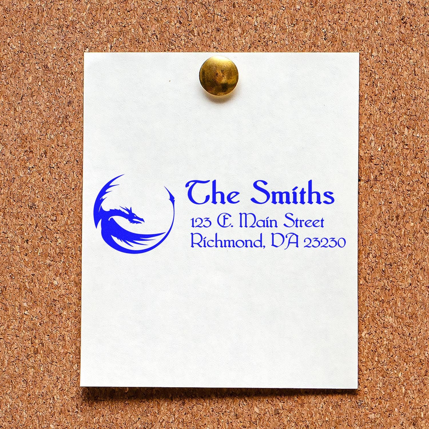 Custom rubber stamp with blue logo and address for The Smiths, shown on paper pinned to a corkboard.
