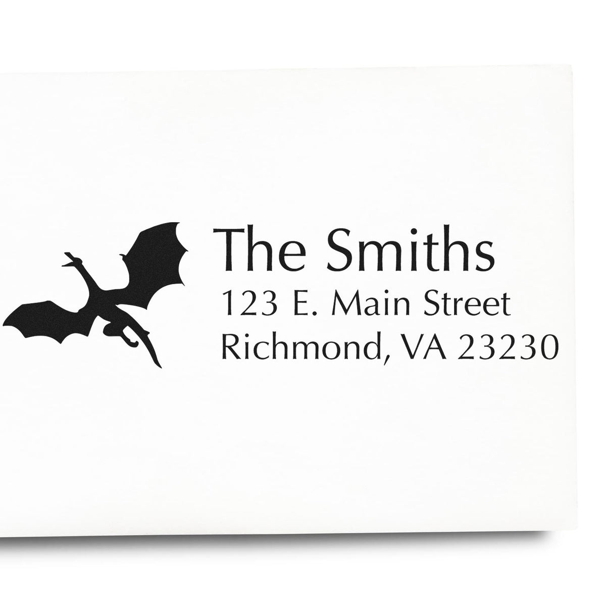 Custom address rubber stamp for The Smiths with dragon design, 123 E. Main Street, Richmond, VA 23230.