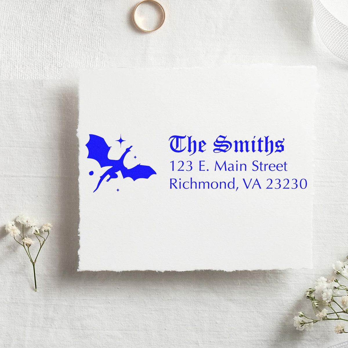 Custom return address rubber stamp with dragon design for The Smiths, Richmond, VA 23230 on stationery.