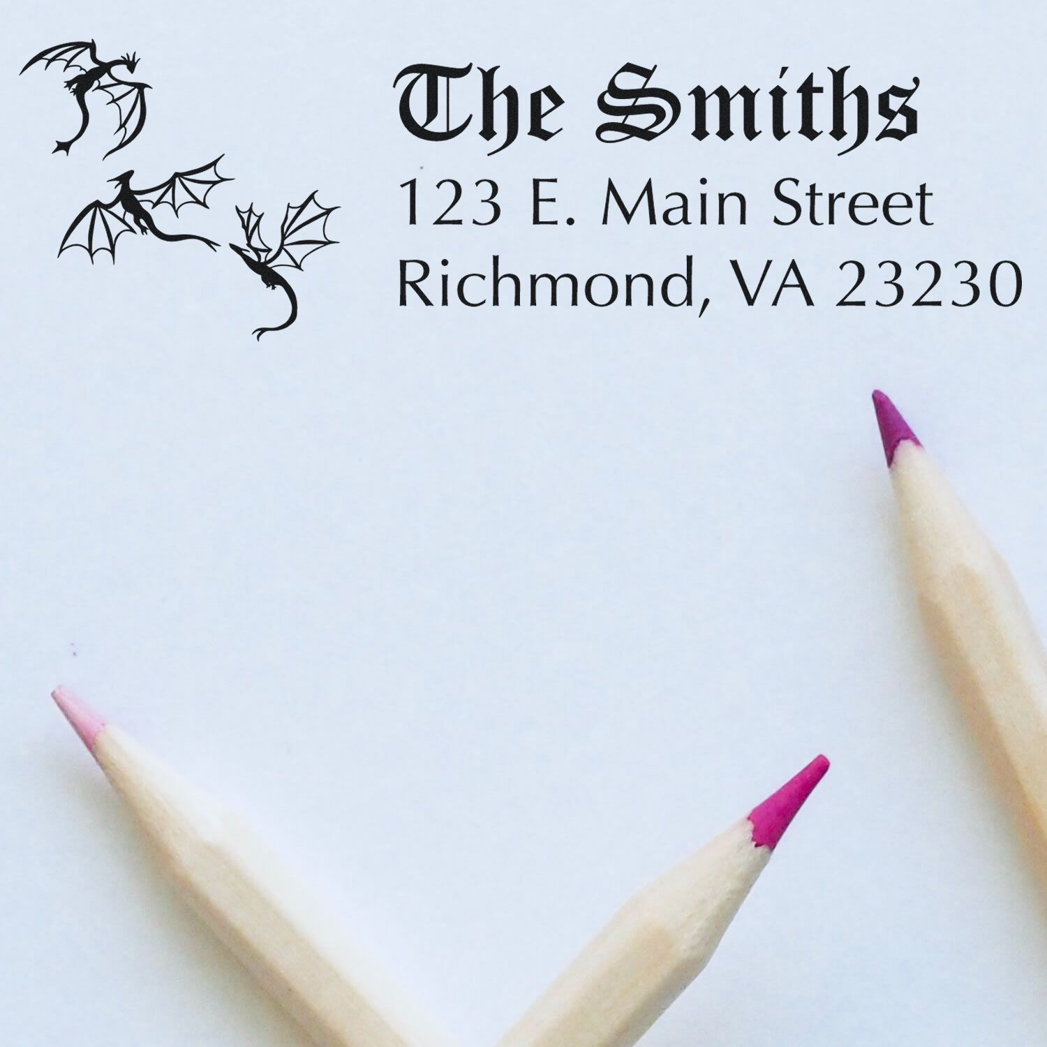 Custom rubber address stamp for The Smiths with dragon design and Richmond, VA return address, ideal for personalized mailing.