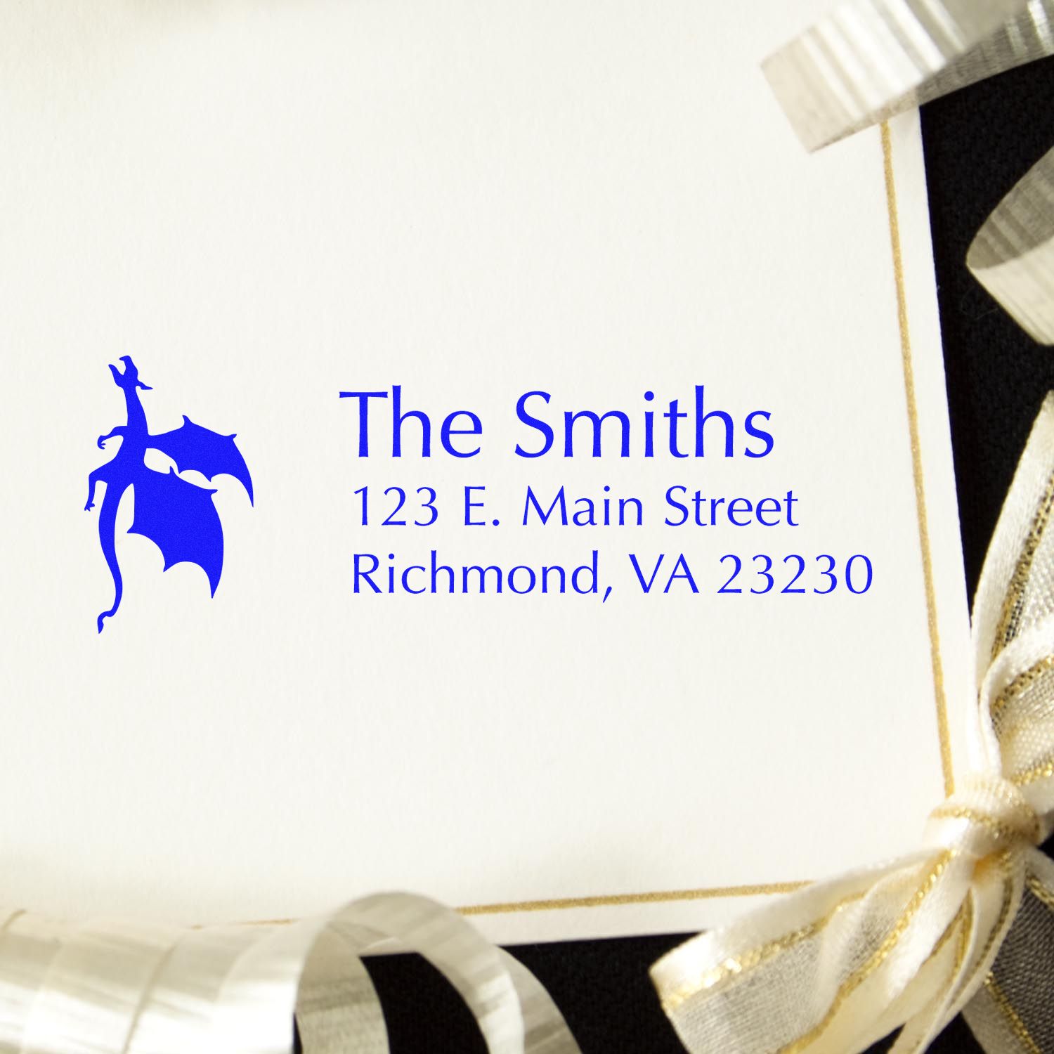 Custom rubber stamp for return address labels, featuring The Smiths, Richmond VA 23230 in blue ink with decorative icon.