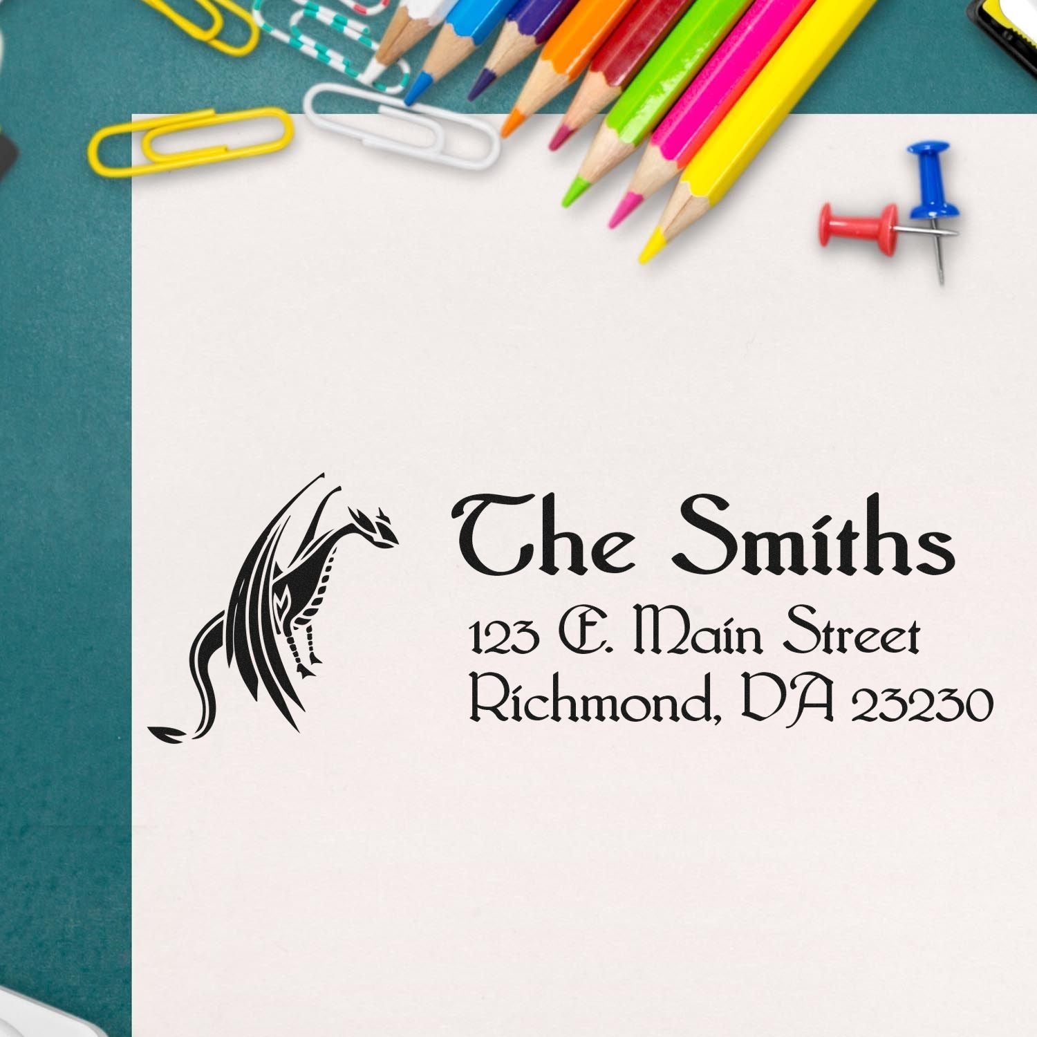 Custom return address rubber stamp for The Smiths with dragon logo, 123 E. Main Street, Richmond, VA 23230.