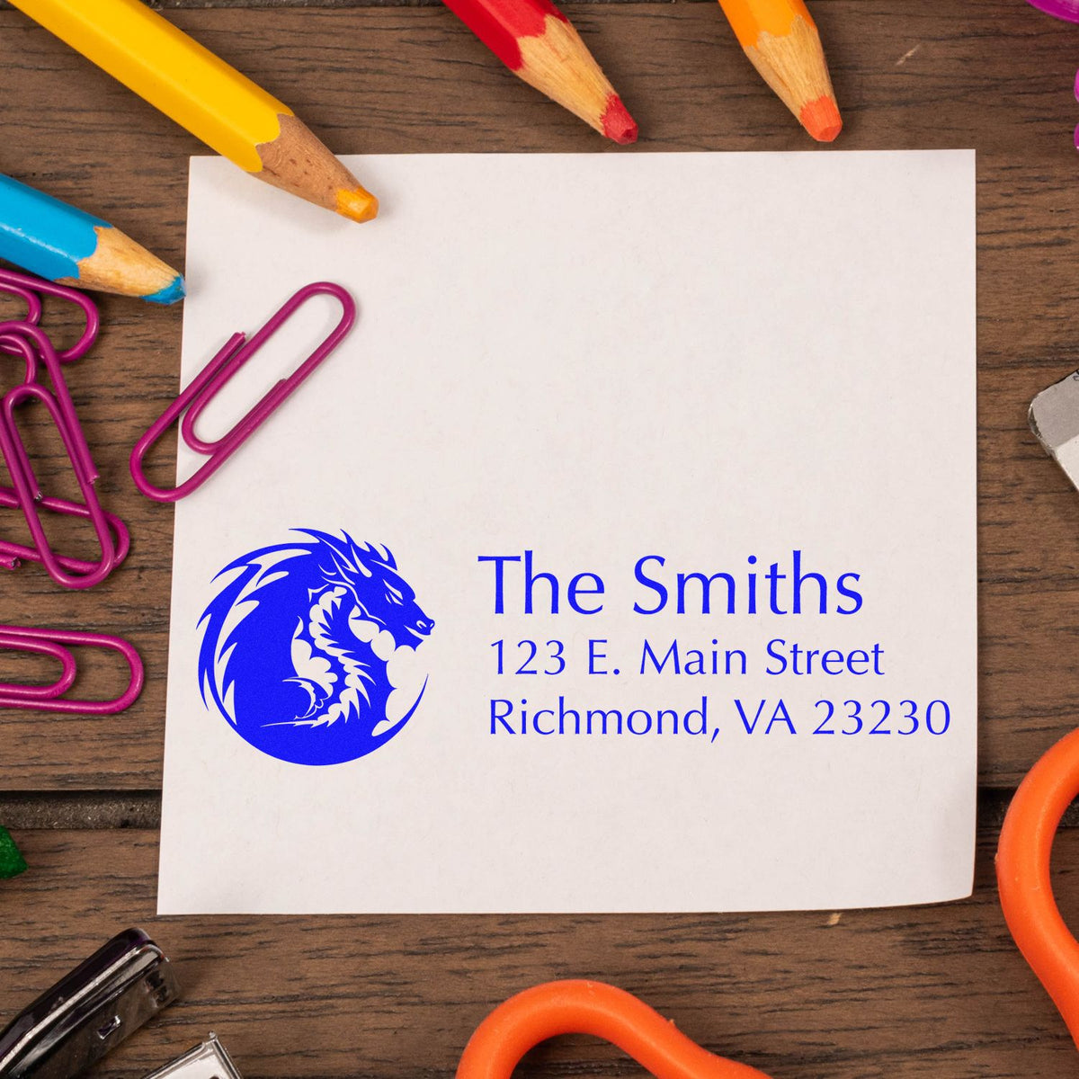 Personalized custom rubber address stamp with dragon logo for The Smiths, showing return address on white paper.