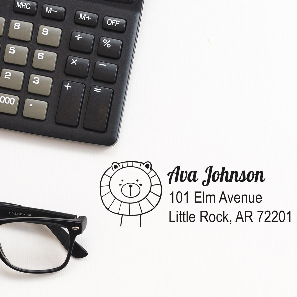 Custom rubber return address stamp with bear logo, Ava Johnson, and Little Rock, AR address for mailing.