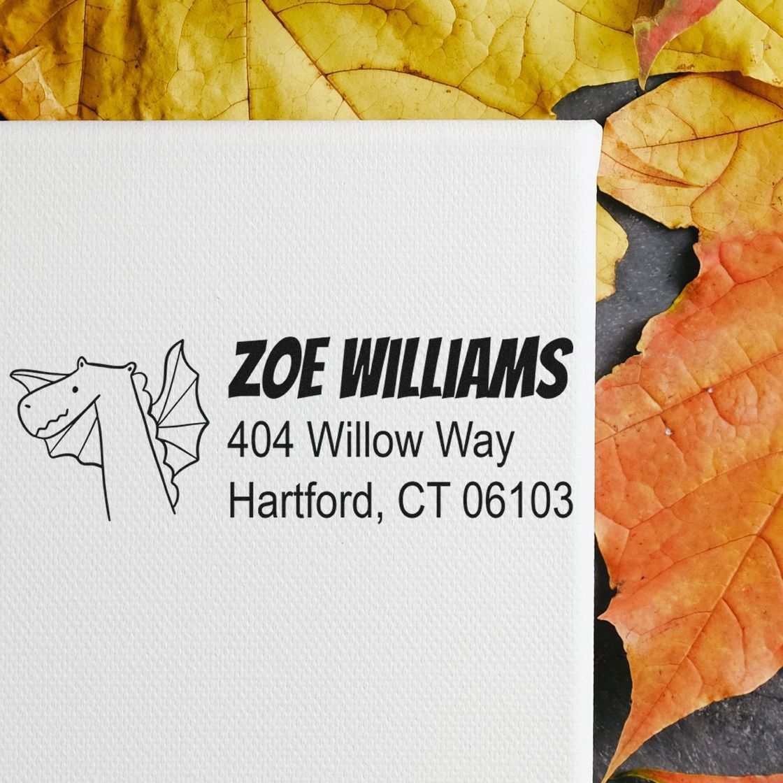 Personalized return address rubber stamp with dragon icon for Zoe Williams, Hartford, CT, on a white envelope.
