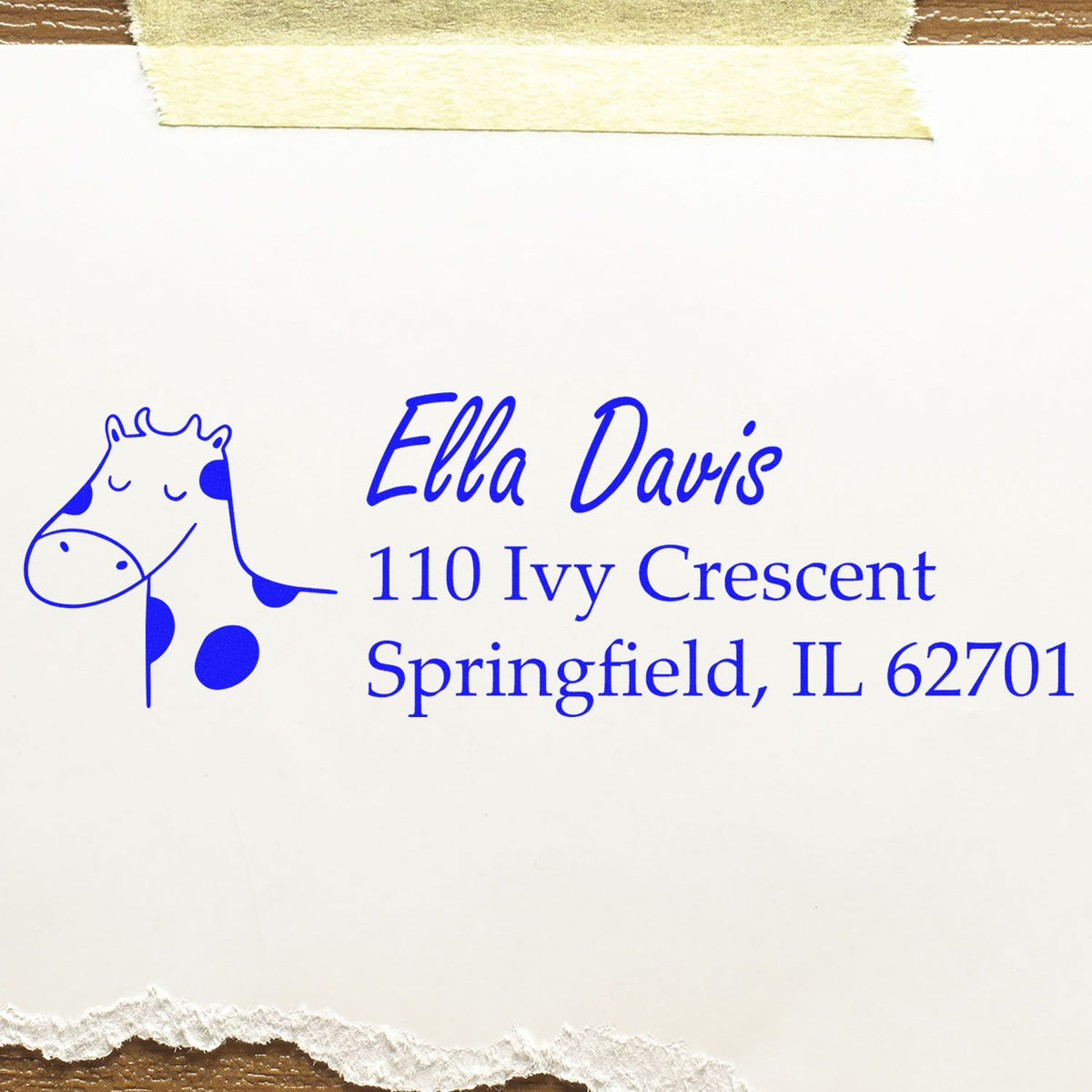 Custom return address rubber stamp with giraffe design and blue ink for Ella Davis, Springfield, IL 62701