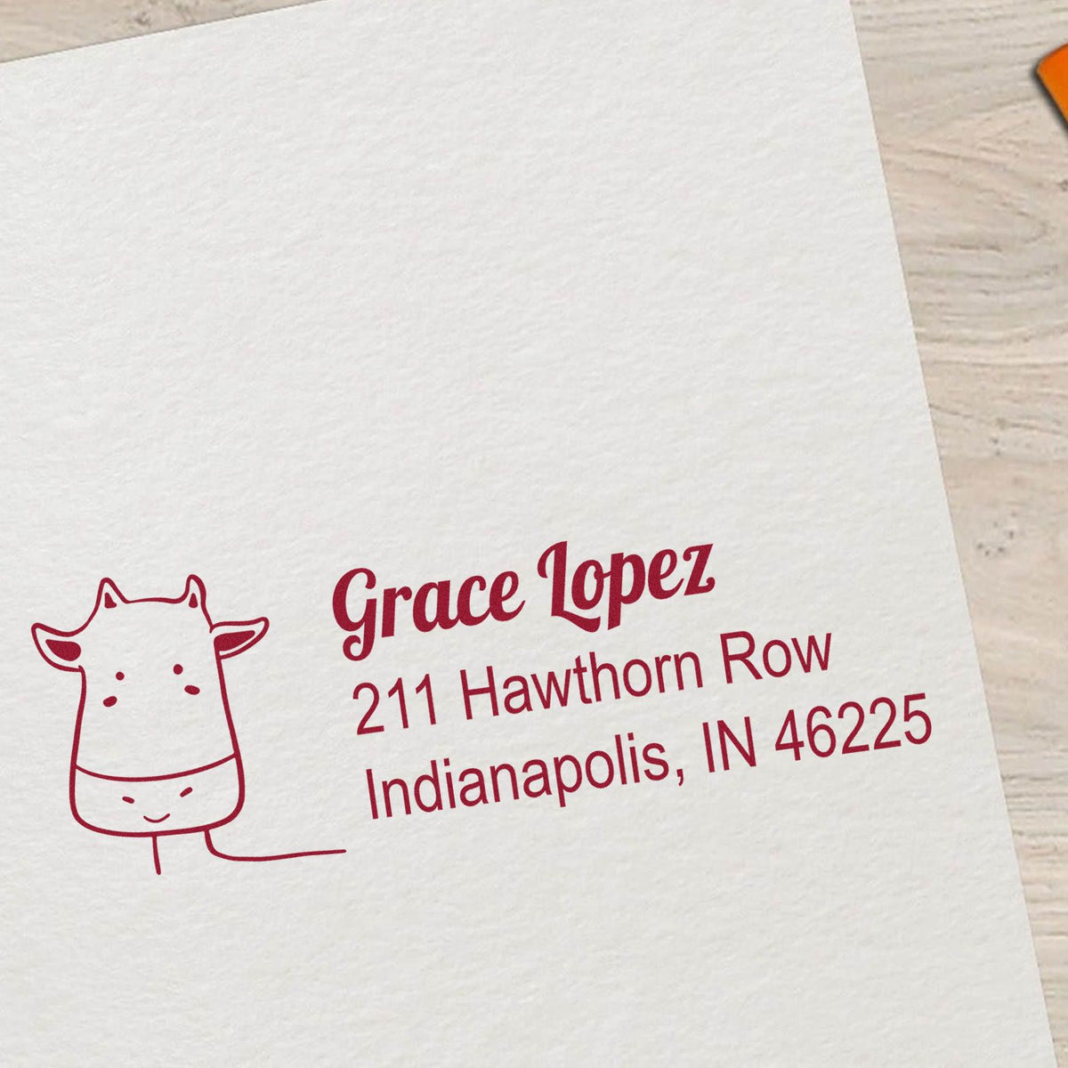 Custom rubber return address stamp with giraffe icon for Grace Lopez, Indianapolis, IN 46225.