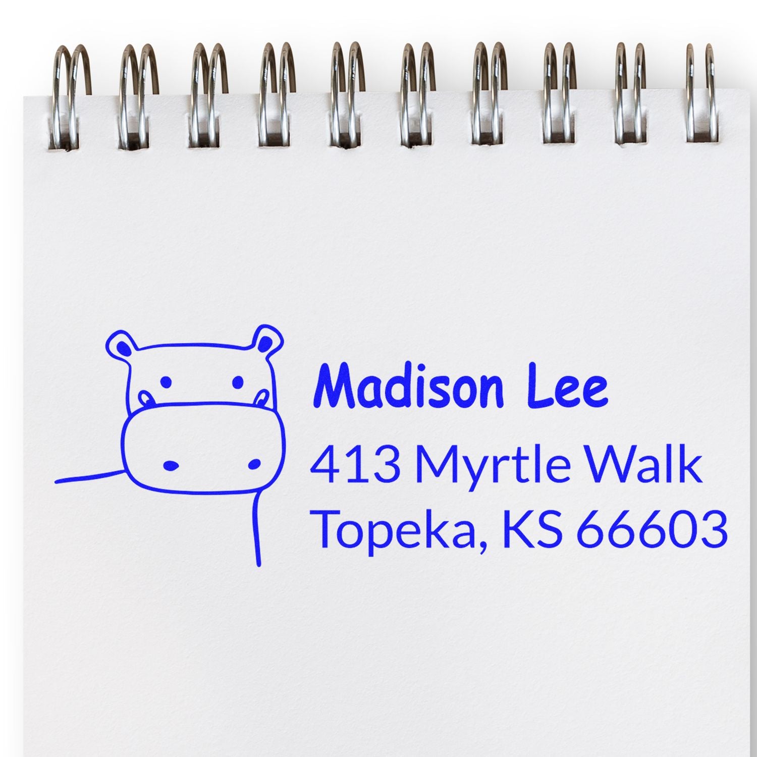 Custom rubber stamp with hippo logo, Madison Lee name, and Topeka, KS return address for mailing.
