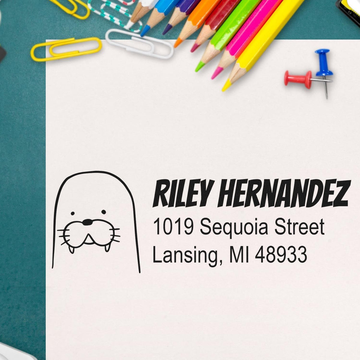 Personalized rubber address stamp design with cat icon for Riley Hernandez, Lansing, MI.