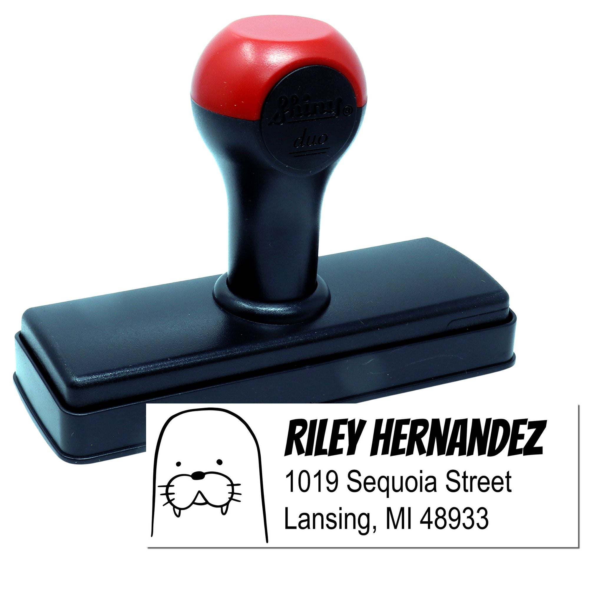 Custom self-inking rubber address stamp with personalized name and address imprint for mailing.