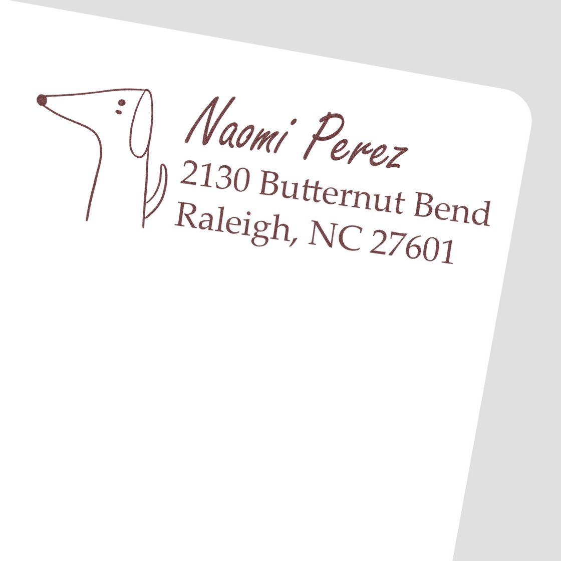 Custom dog return address rubber stamp for Naomi Perez, 2130 Butternut Bend, Raleigh, NC 27601