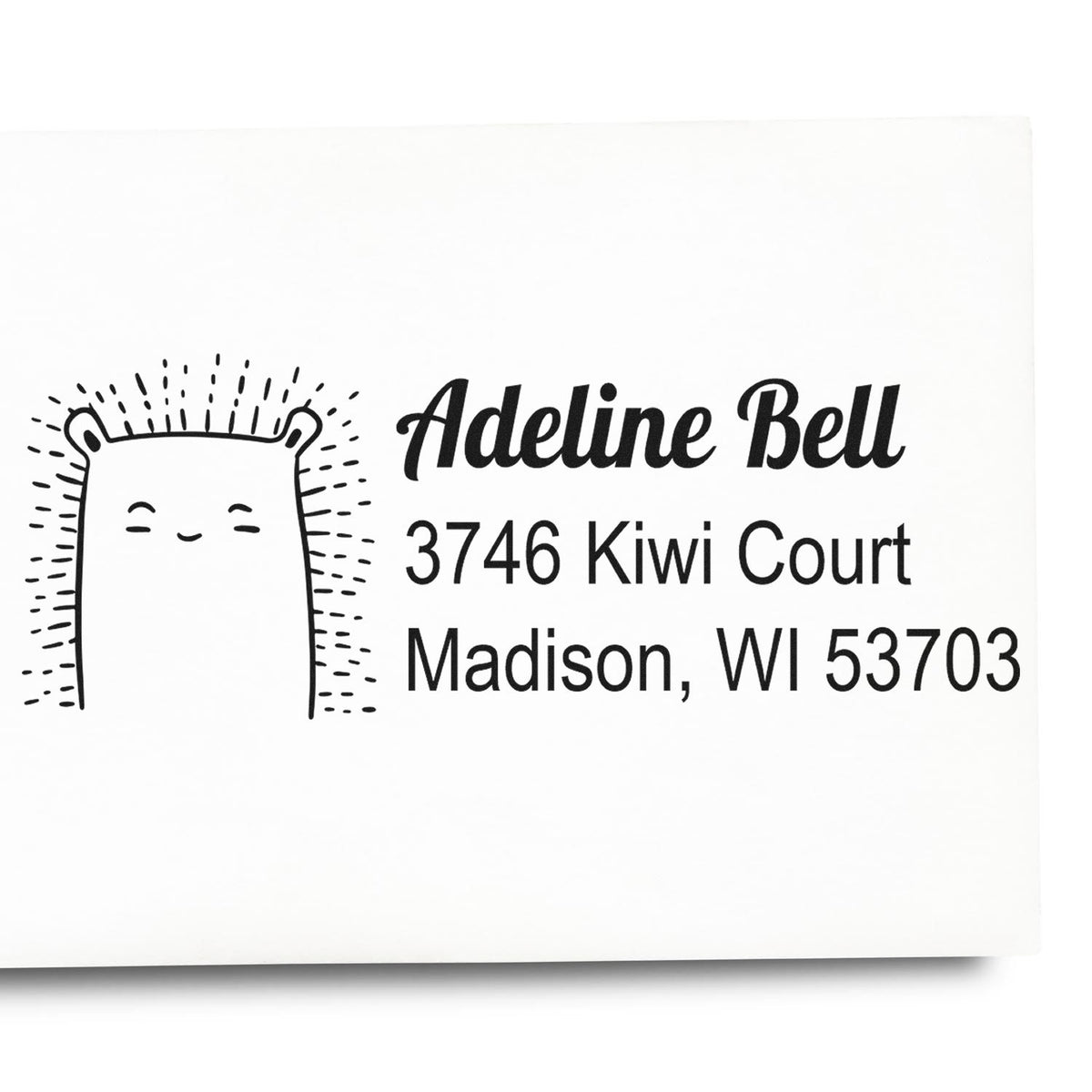 Custom rubber address stamp for Adeline Bell with bear design and Madison, WI 53703 mailing address.
